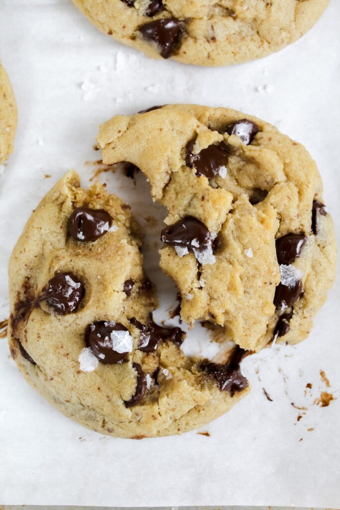 classic vegan chocolate chip cookie broken in half