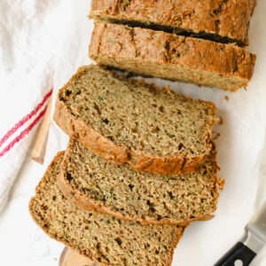 sliced zucchini bread on a wooden board