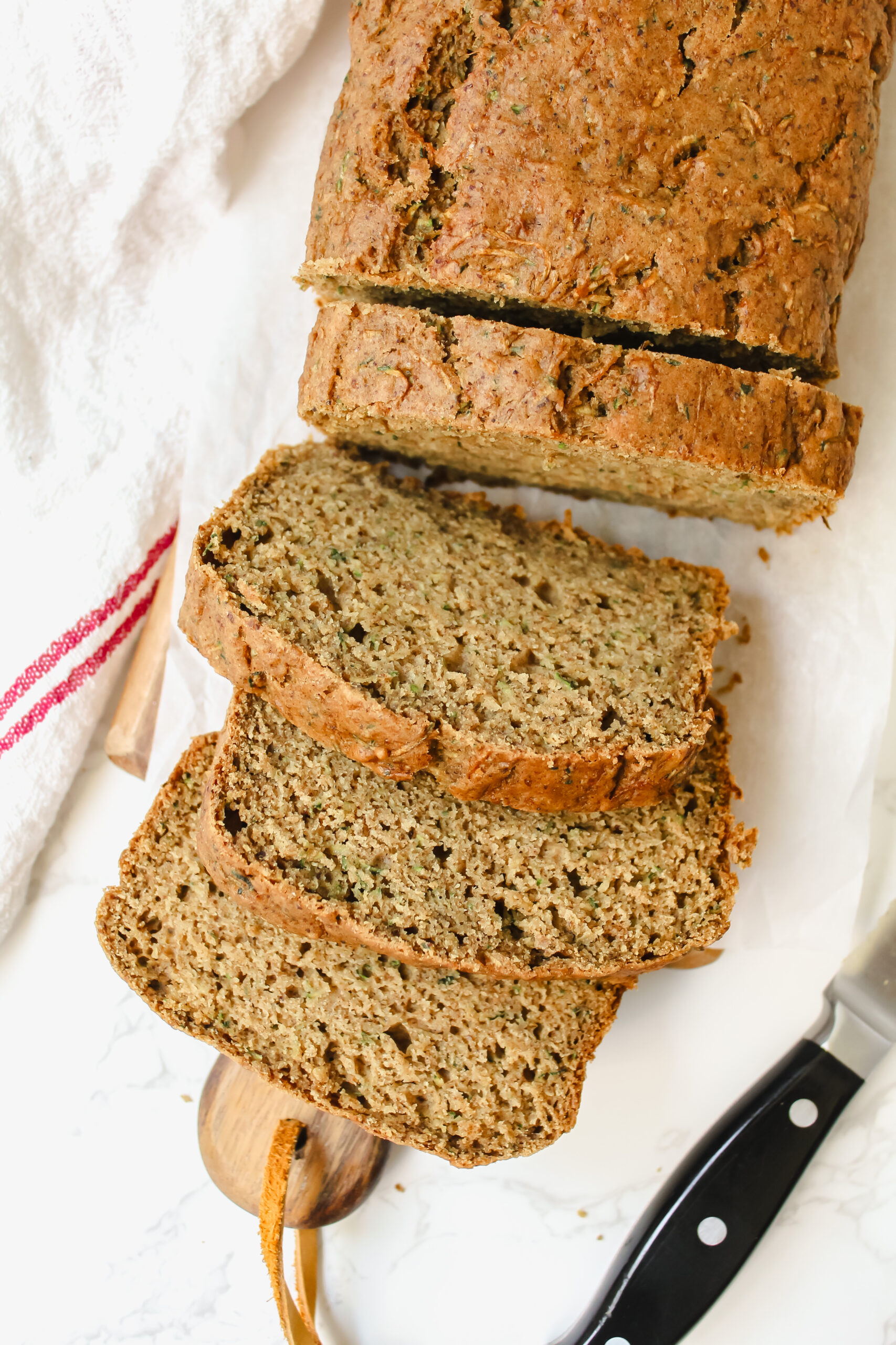 sliced zucchini bread on a wooden board