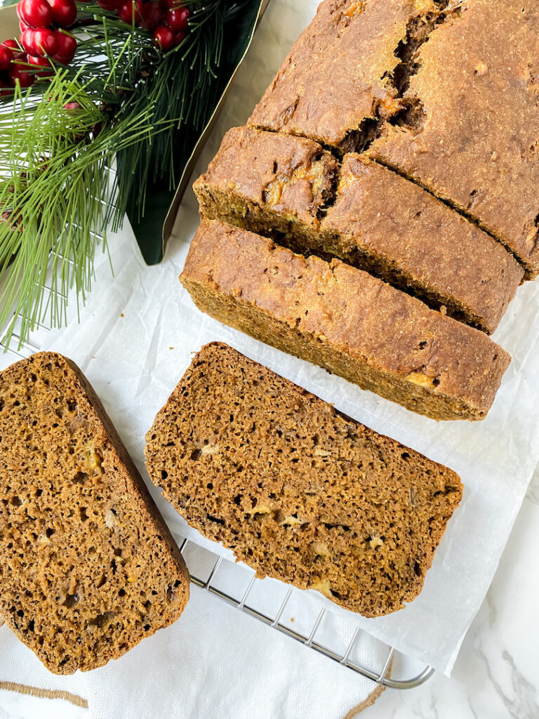 overview shot of gingerbread banana bread with slices cut 