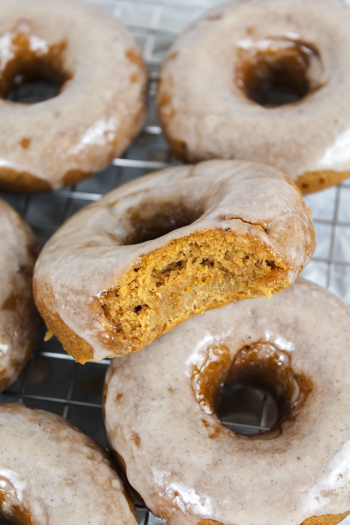 bite taken out of a pumpkin donut
