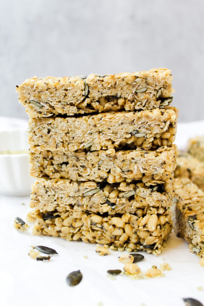 five super seedy granola bars stacked on top of each other