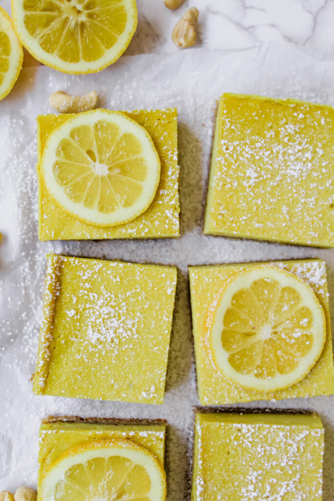 overview shot of a few slices of creamy vegan lemon bars