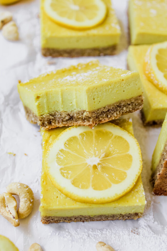 a slice of lemon bar with a bite taken out