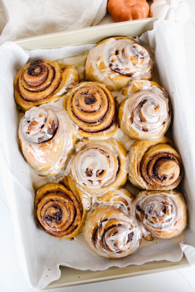 overview shot of pan of pumpkin cinnamon rolls