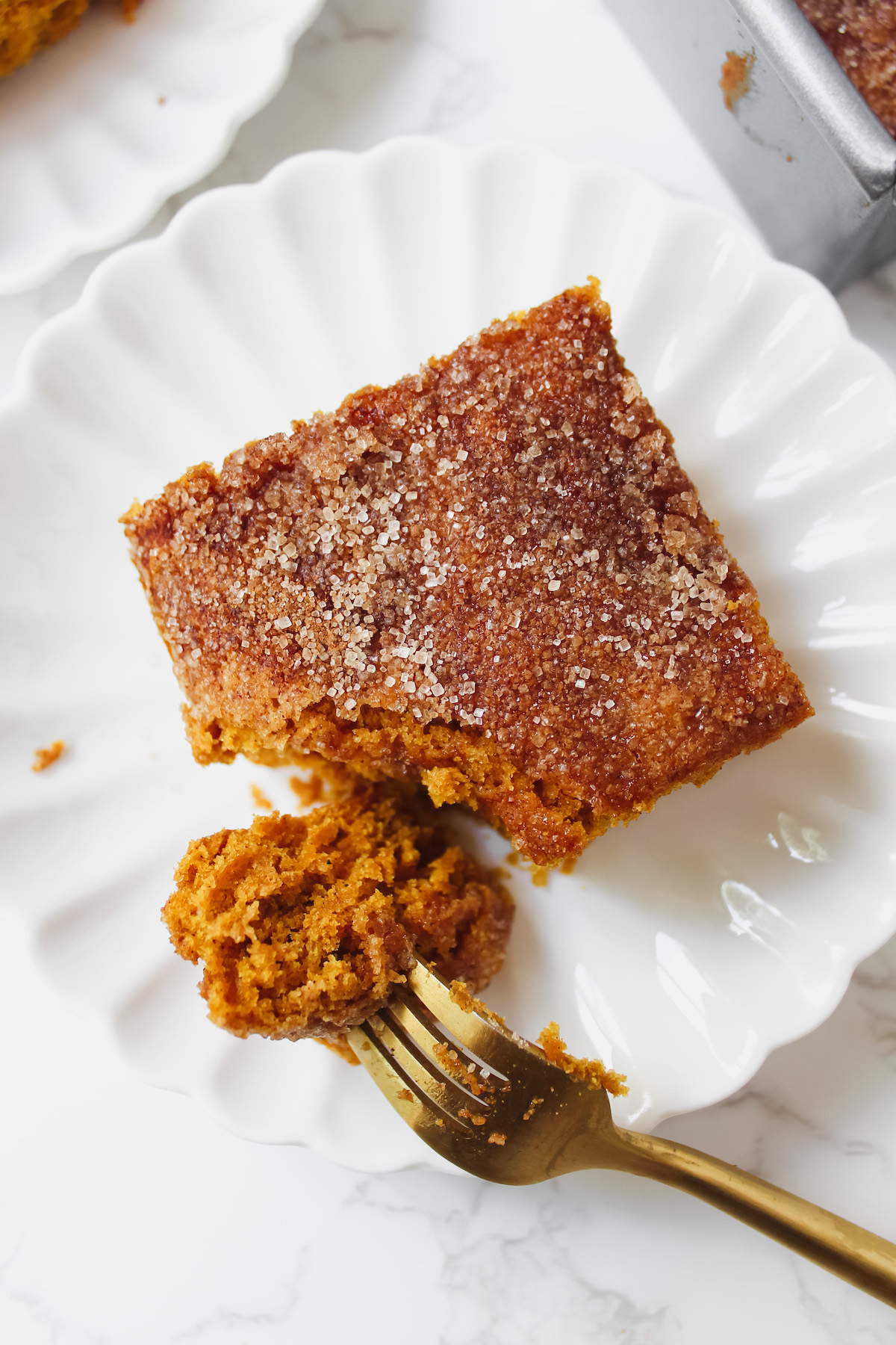 a fork with a bite of pumpkin bar on it