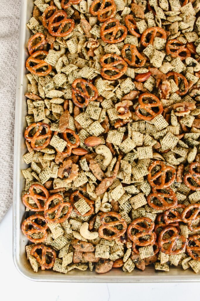 overview shot of chex mix on baking sheet