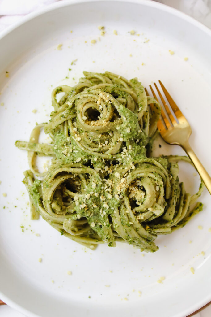 overview shot of pasta noodles with pesto