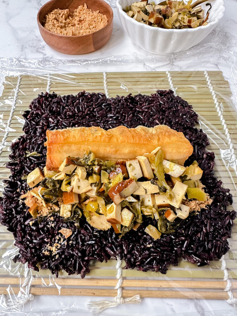 angled shot of sticky rice with filling on top