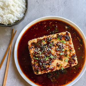 picture of silken tofu and rice with chopsticks on the side