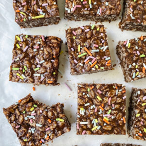 overview shot of chocolate protein rice crispy treats with a bite taken out