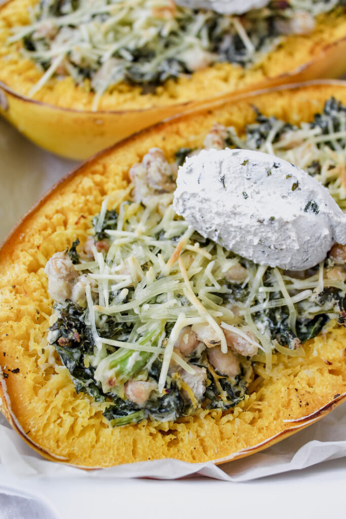 close up of stuffed spaghetti squash with cream cheese on top