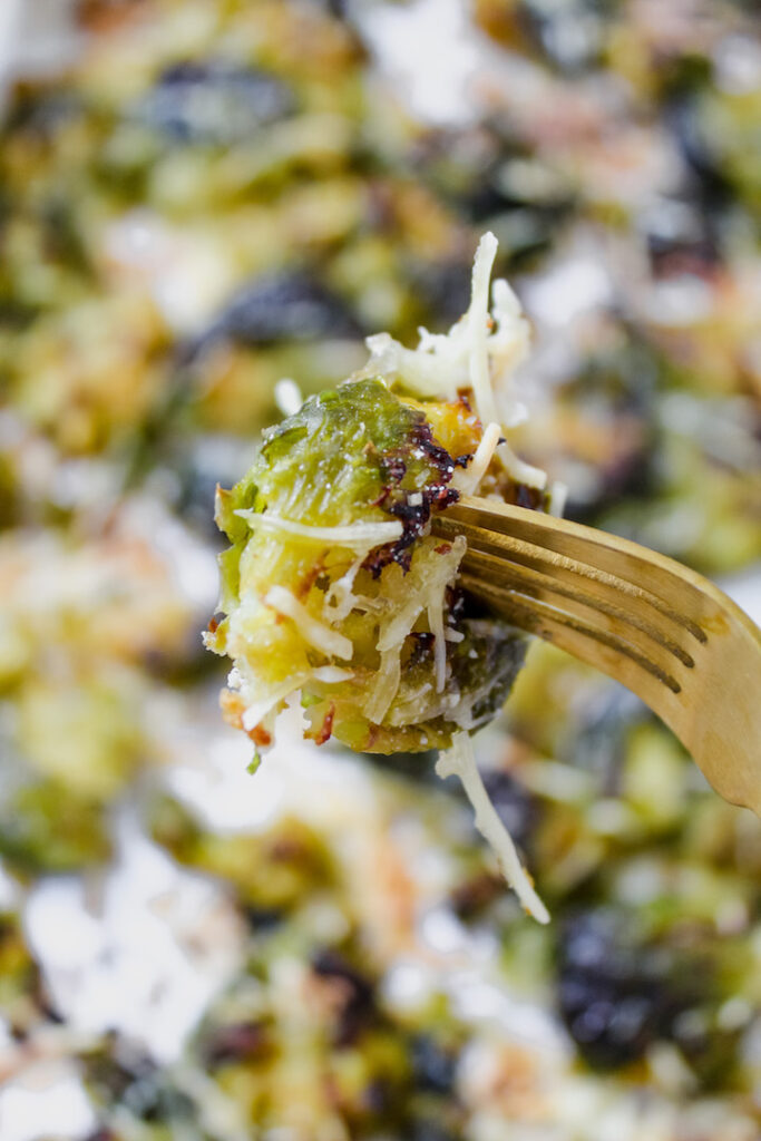 close up of fork in a smashed brussels sprout