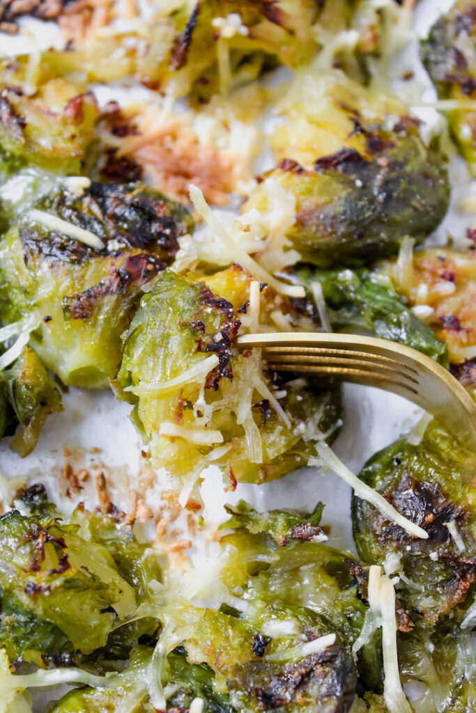 fork in a smashed brussels sprout