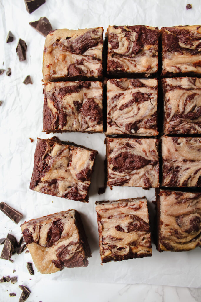 overview shot of strawberry cheesecake swirl brownies cut into squares