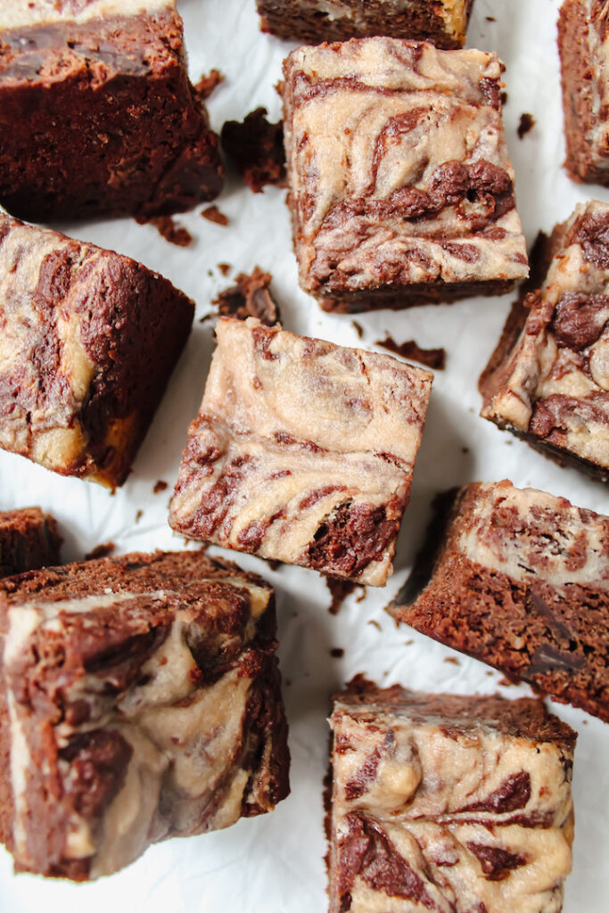 photo of strawberry cheesecake swirl brownie slices placed at different angles