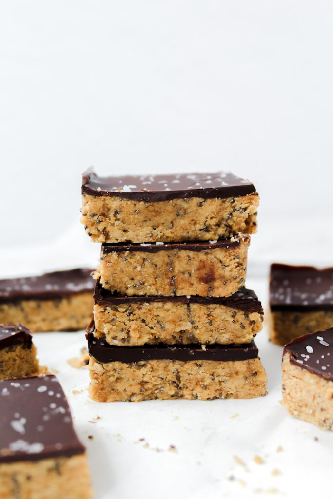 chocolate peanut butter protein bars stacked on top of each other
