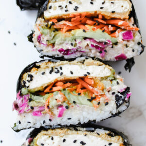 close up of sushi sandwiches cut in half