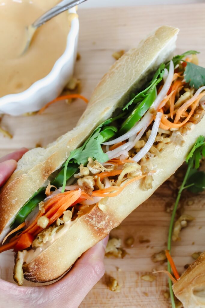 hand holding banh mi
