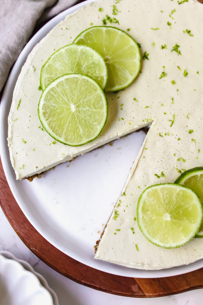 overview shot of key lime pie with a slice take out