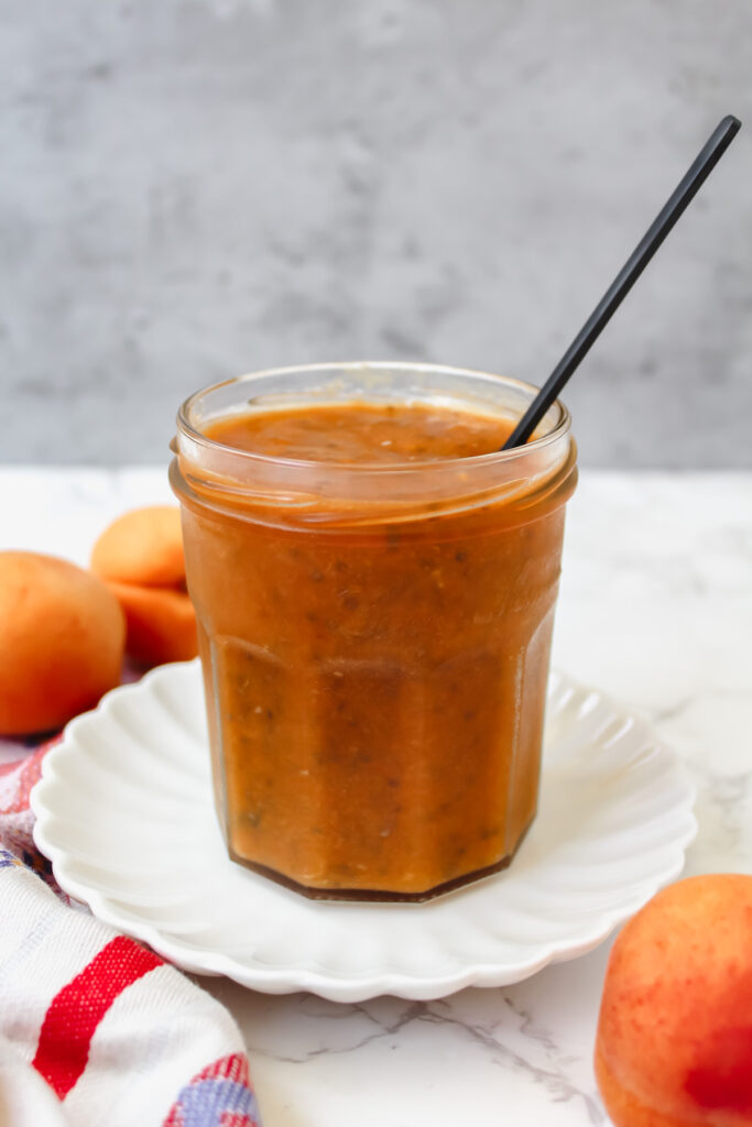 side picture of a jar of apricot chia seed jam