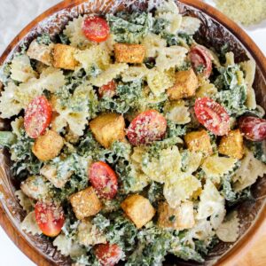 overview shot of kale caesar pasta salad with crispy tofu
