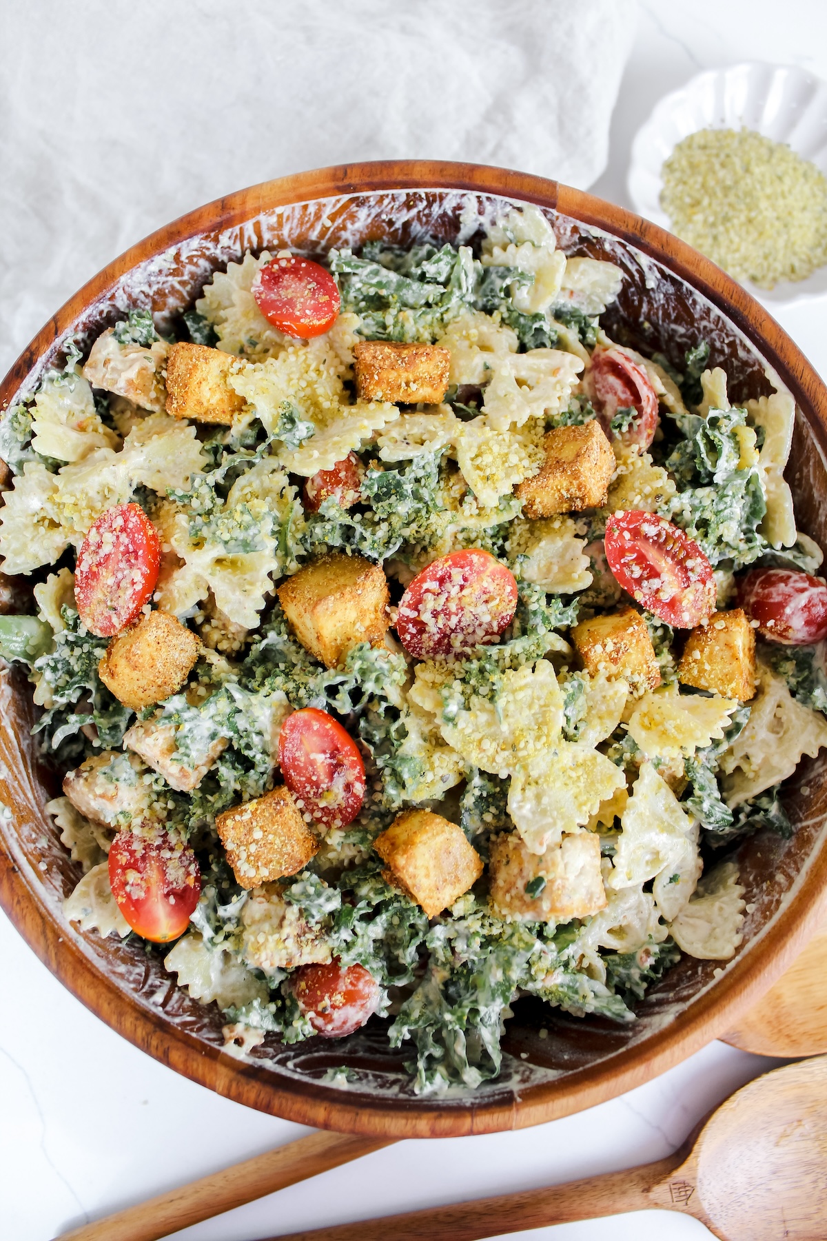 overview shot of kale caesar pasta salad with crispy tofu