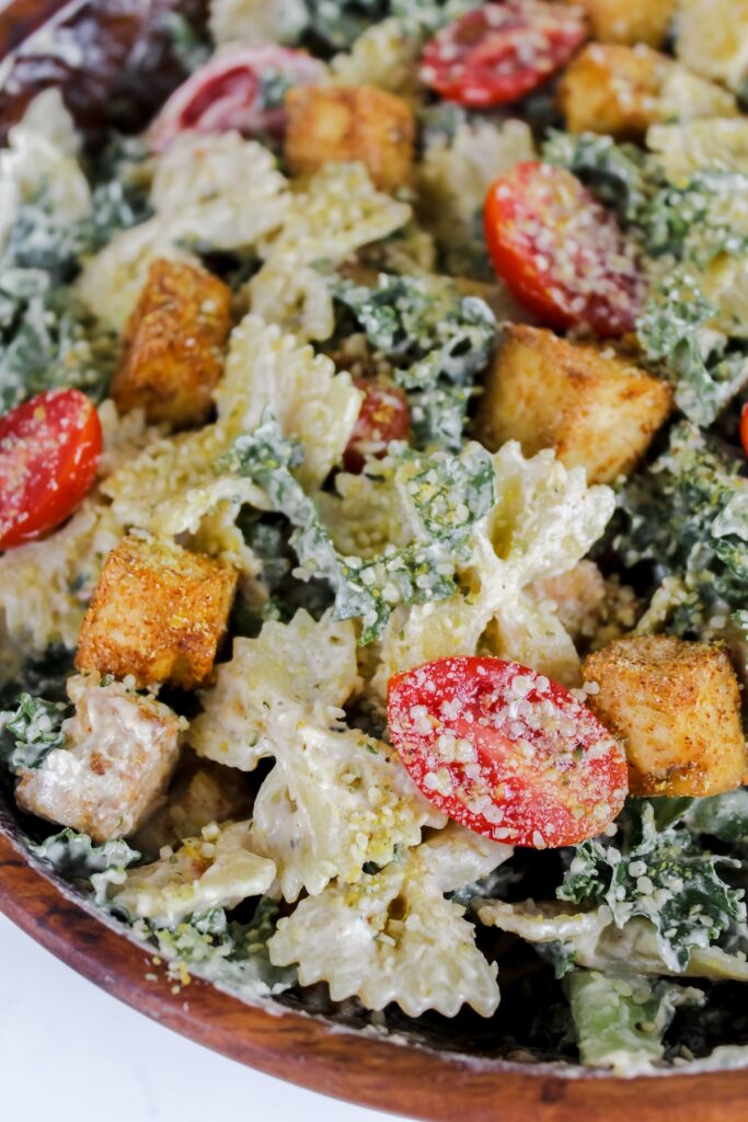 close up shot of kale caesar pasta salad