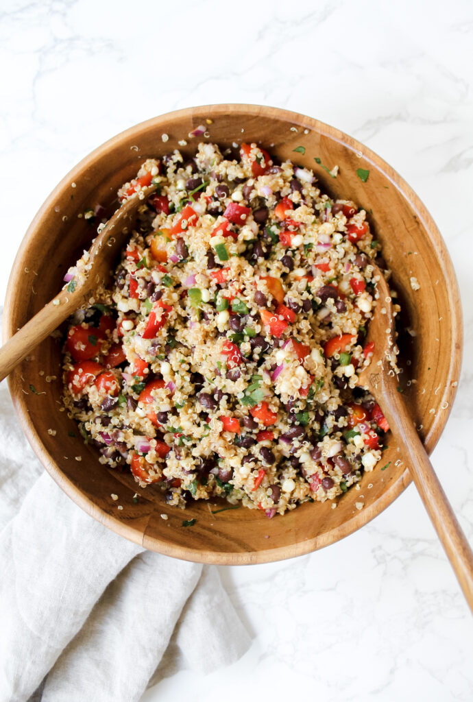 overview shot of wooden bowl with southwest quinoa salad