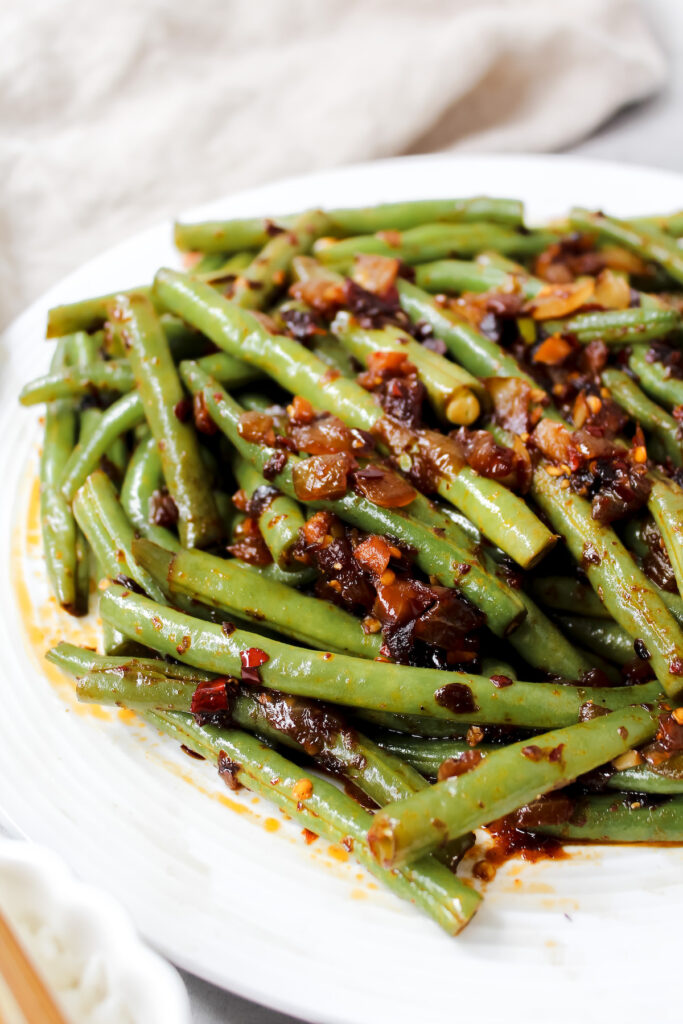 close up angled shot of chili crisp string beans