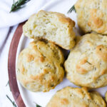 biscuits on a plate with one biscuit cut in half