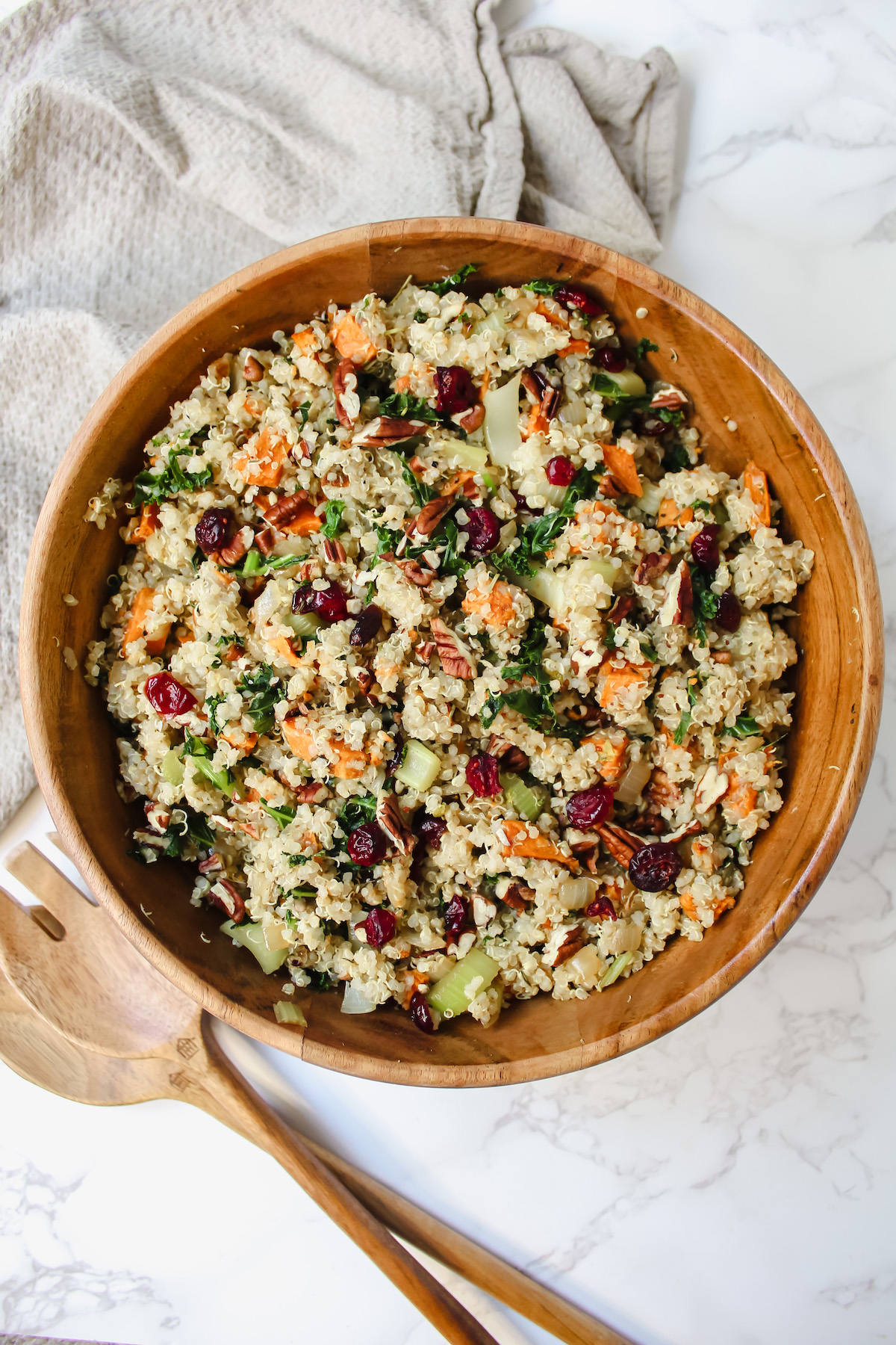 overview shot of roasted sweet potato quinoa stuffing in a wooden bowl