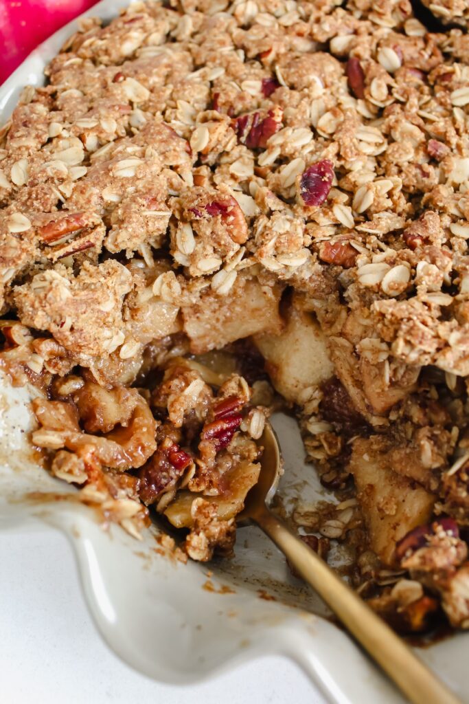 spoon in the pie pan wtih the apple crisp