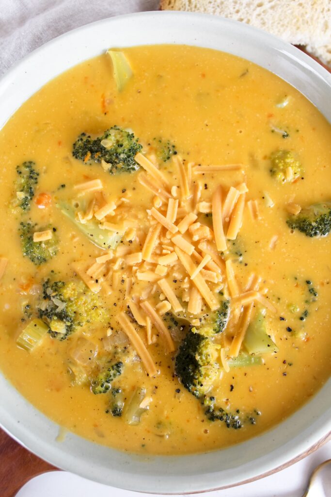 overview shot of bowl of broccoli cheese soup
