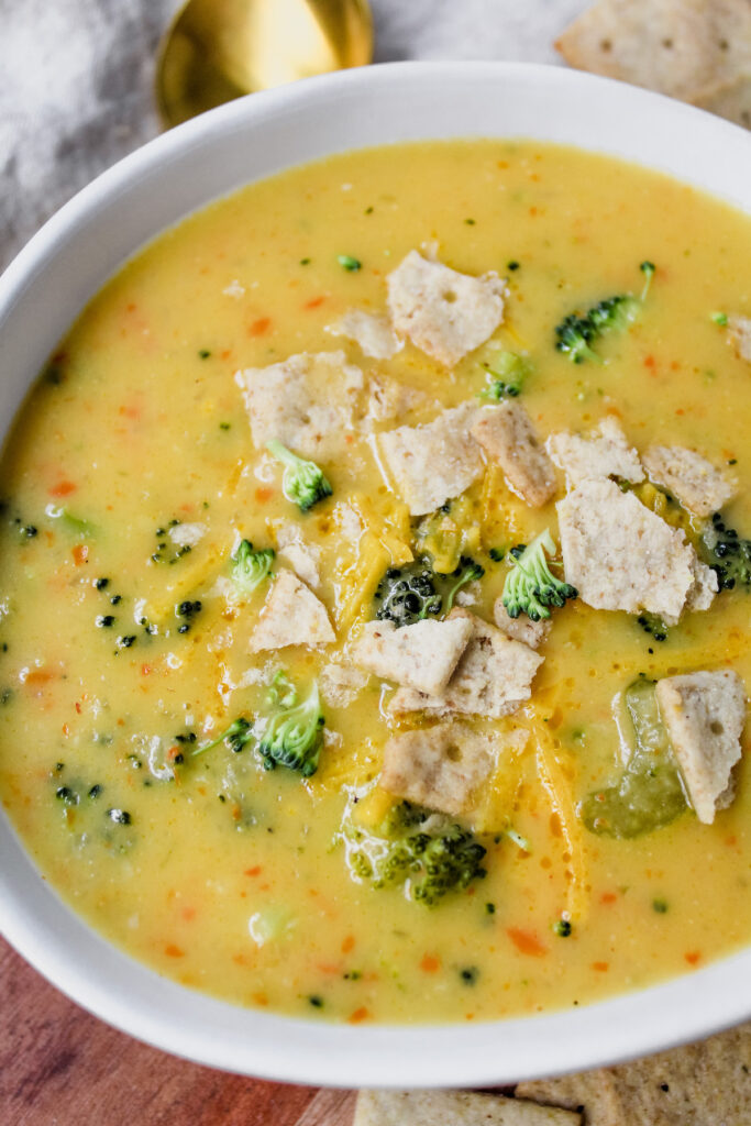 Close up shot of a bowl of vegan broccoli cheese soup
