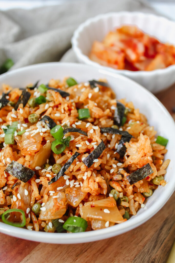 angled shot of bowl of rice and kimchi