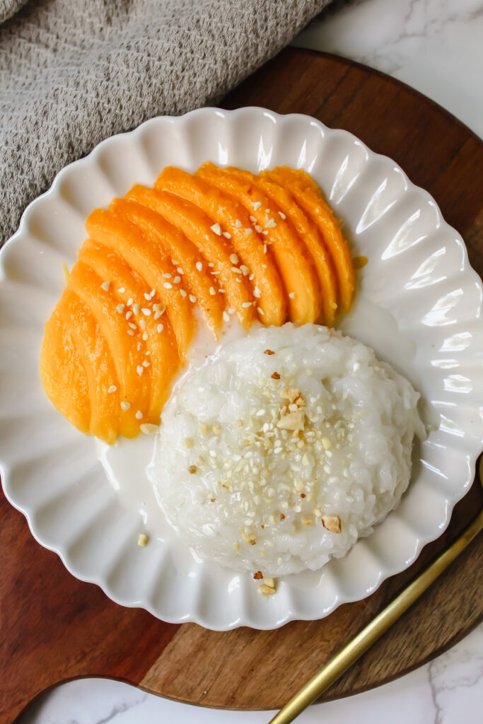 Overview shot of thai mango sticky rice on a plate 