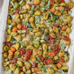 overview shot of entire pan of pesto gnocchi