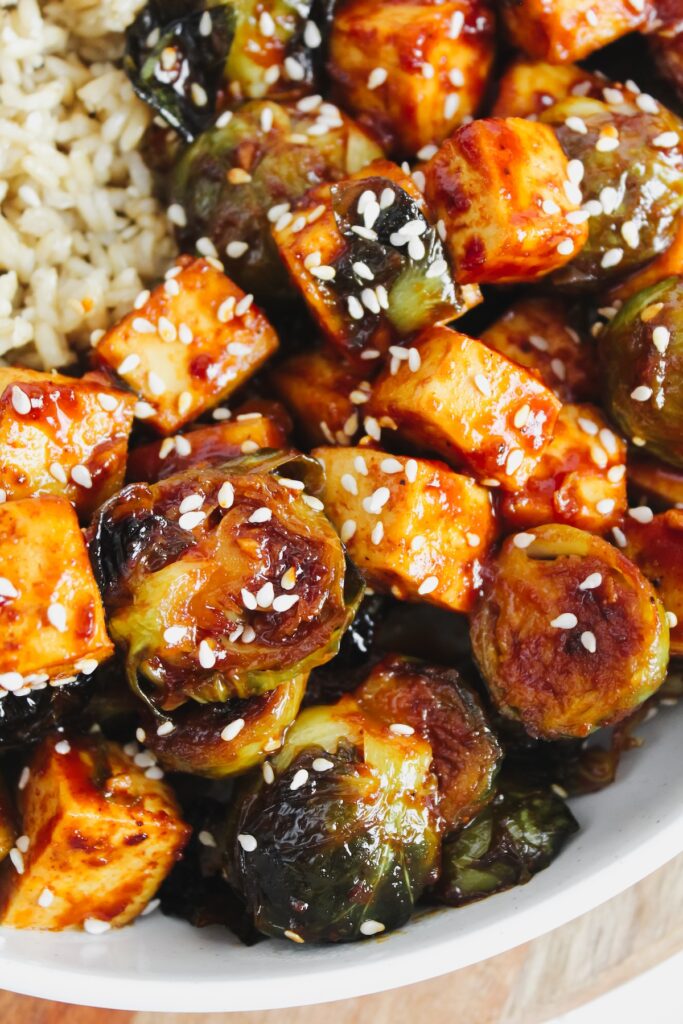 close up shot of gochujang roasted brussels sprouts and tofu