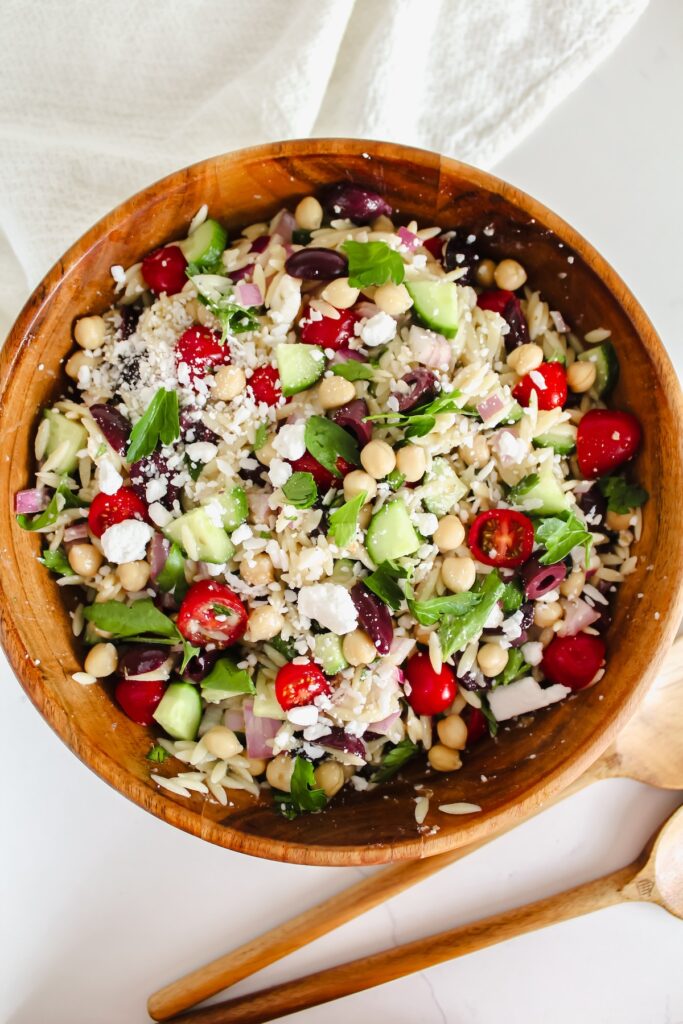 overview shot of entire bowl of greek orzo salad
