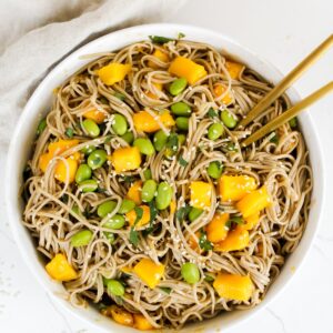 overview shot of mango edamame soba noodle salad