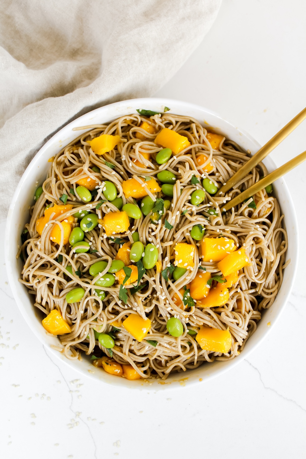 overview shot of mango edamame soba noodle salad