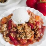 angled shot of crisp on a plate with ice cream