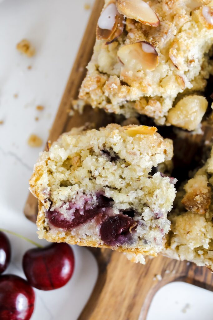 close up shot of a slice of  cherry almond coffee cake