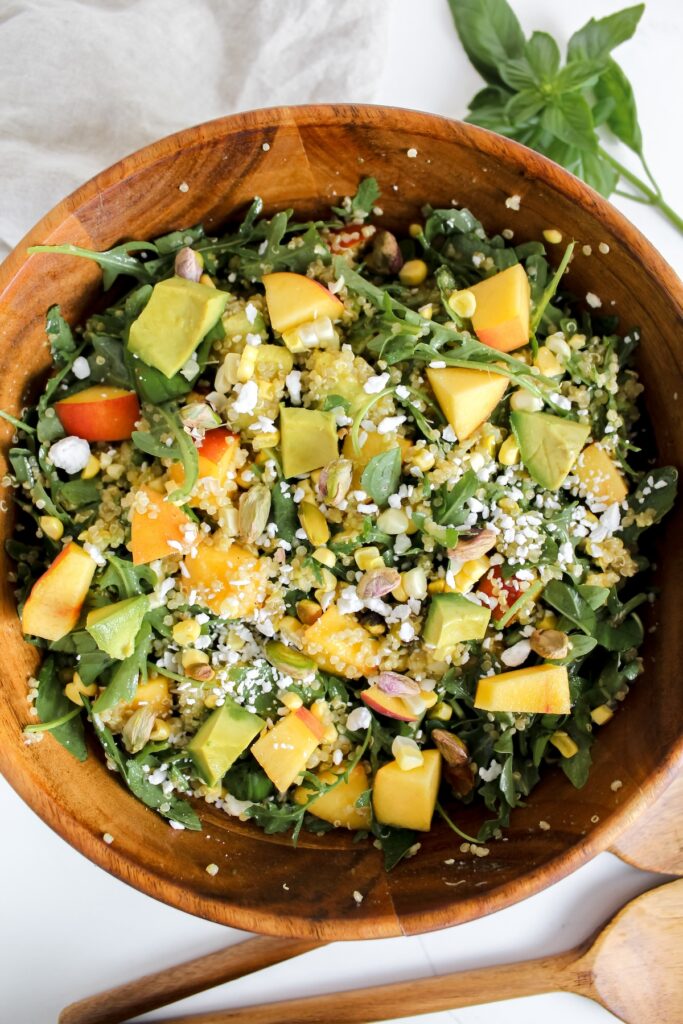 overview shot of entire bowl of summer peach quinoa salad