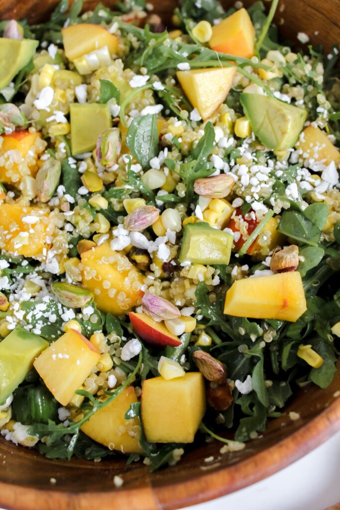 close up shot of peach quinoa salad