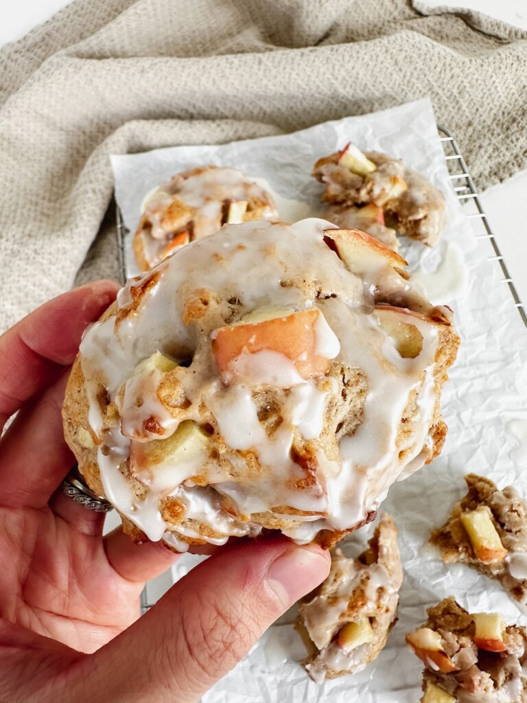 hand holding an apple fritter