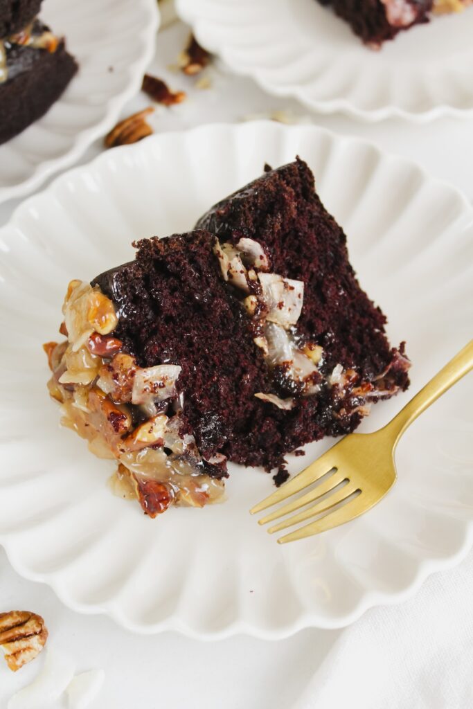 slice of german chocolate cake on white plate