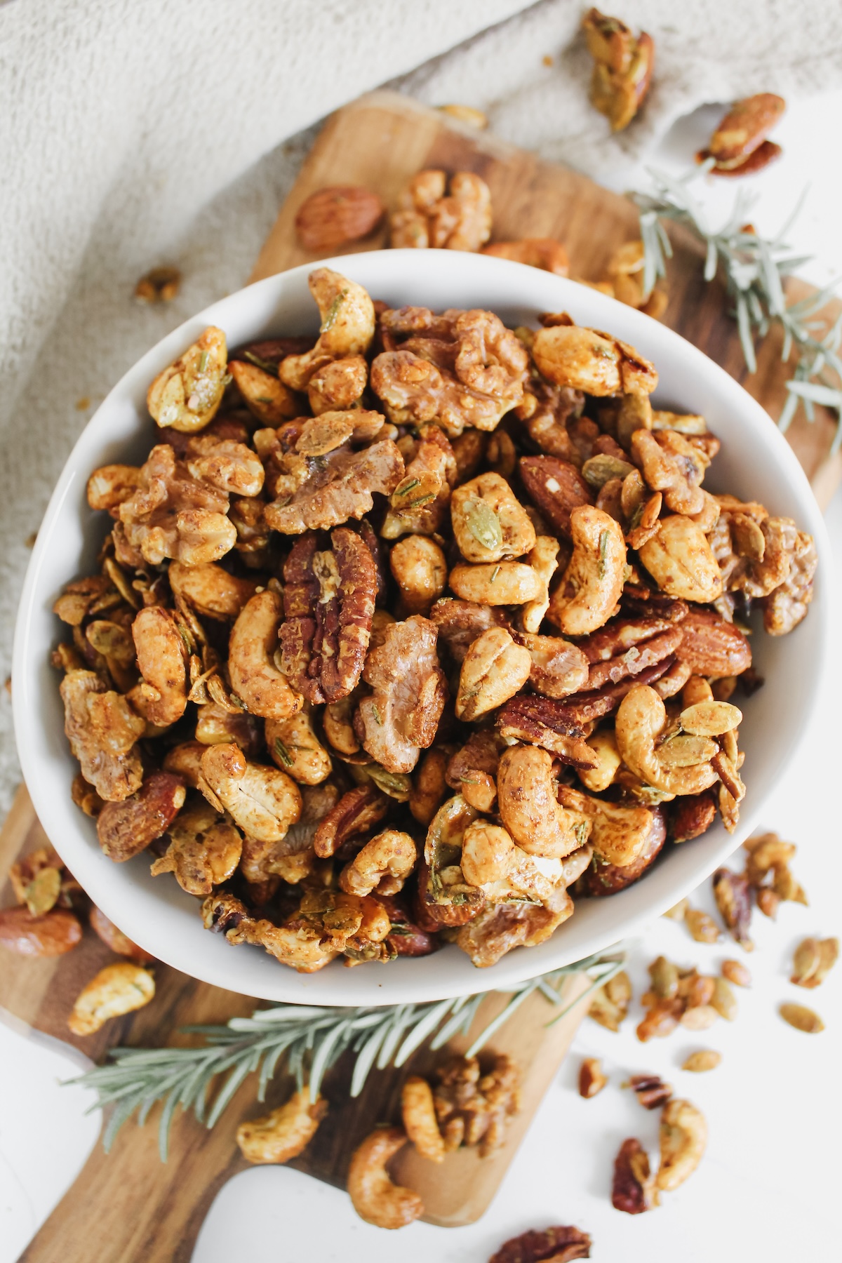 overview shot of rosemary spiced roasted nuts in a bowl