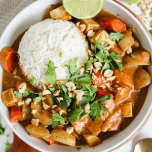 overview shot of a bowl with thai massaman curry and rice